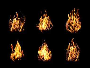 Collection of bright fire flames on black background clipart