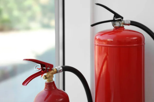 Extintores Incêndio Diferentes Perto Janela Dentro Casa Close — Fotografia de Stock