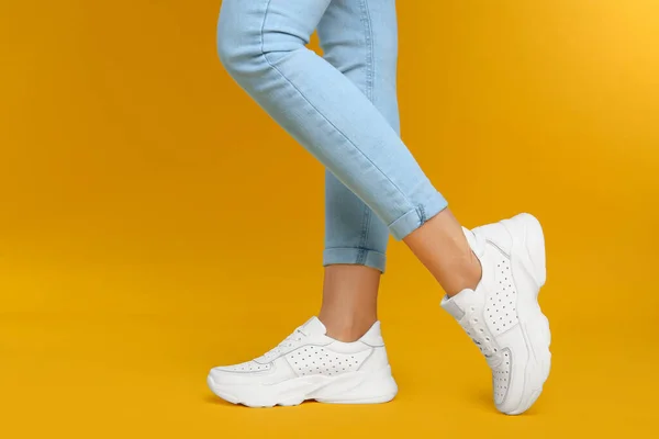 Woman Wearing Stylish Sneakers Yellow Background Closeup — Stock Photo, Image