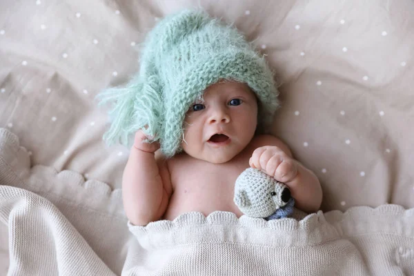 Cute Newborn Baby Warm Hat Toy Lying Bed Top View — Stock Photo, Image