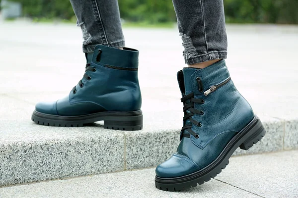 Woman wearing comfortable stylish boots outdoors, closeup