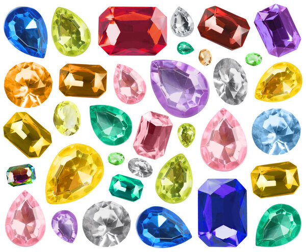 Набор различных ярких драгоценных камней, изолированных на белом
