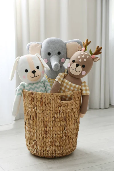 Funny toys in basket on floor. Decor for children\'s room interior