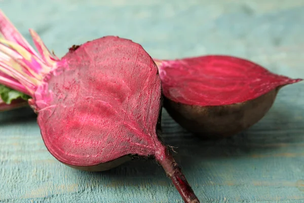 Halves Raw Beet Blue Wooden Table Closeup — Stock Photo, Image