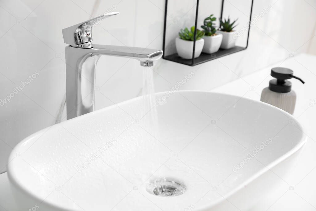 Stylish vessel sink on bathroom counter. Interior design