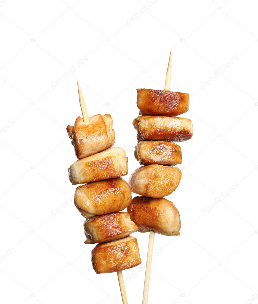Delicious chicken shish kebabs on white background