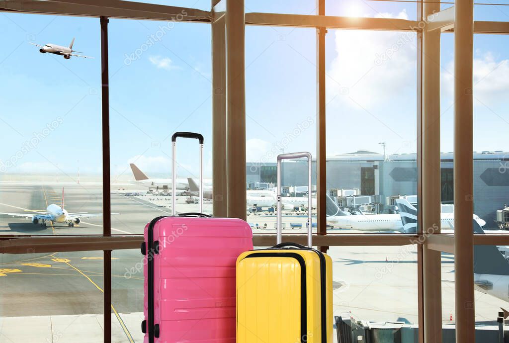 Travel suitcases in airport terminal. Summer vacation