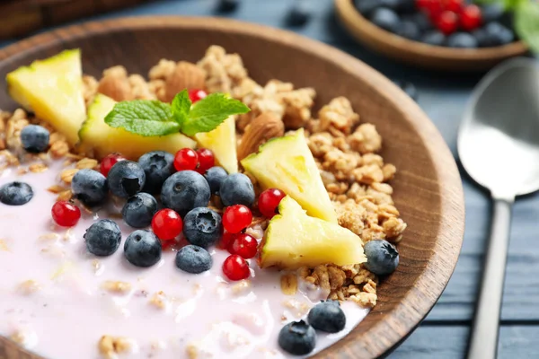 Tasty Granola Yogurt Berries Sliced Pineapple Breakfast Blue Wooden Table — Stock Photo, Image