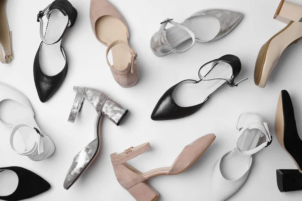 Muchos Zapatos Femeninos Con Estilo Sobre Fondo Blanco Vista Superior —  Fotos de Stock