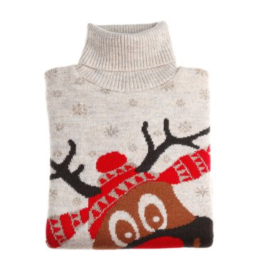 Katlanmış sıcak bir Noel süveteri ve beyaz bir geyik.