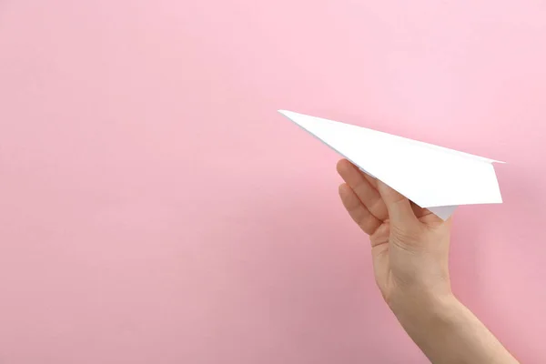 Woman Holding Paper Plane Pink Background Closeup Space Text — Stock Photo, Image
