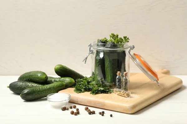 Pickling jar with fresh ripe cucumbers and spices on white wooden table — Stock Image Pickling Jar Fresh Ripe Cucumbers Spices White Wooden Table Royalty Free Stock Images