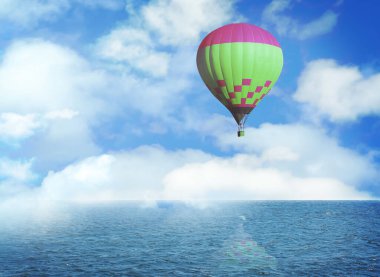 Hayal dünyası. Mavi gökyüzünde sıcak hava balonu ve deniz üzerinde bulutlar.