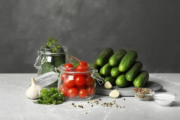 Pickling jars with fresh ripe vegetables and spices on grey table — Stock Image Pickling Jars Fresh Ripe Vegetables Spices Grey Table Royalty Free Stock Photos