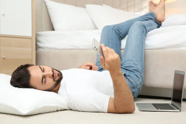 Lazy Young Man Laptop Smartphone Lying Floor Home — Stock Photo, Image