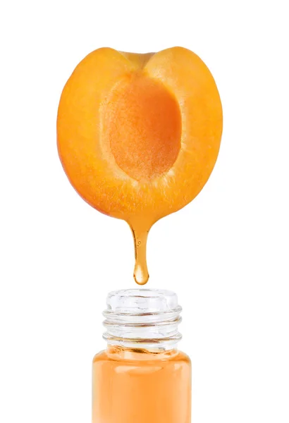Apricot Oil Dripping Fresh Fruit Half Glass Bottle White Background — Stock Photo, Image