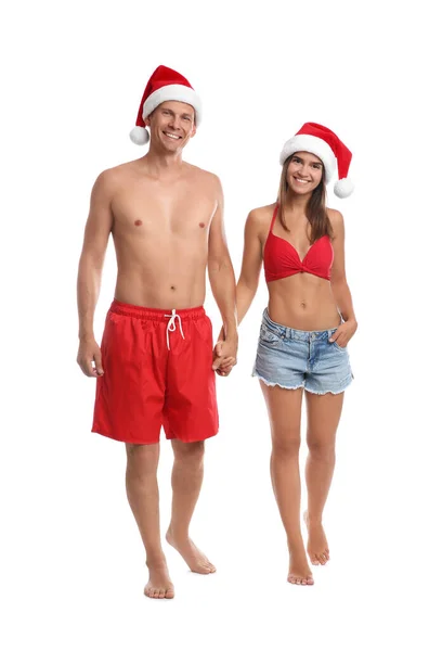Beyaz Arka Planda Noel Baba Şapkalı Mutlu Çift Noel Tatili — Stok fotoğraf