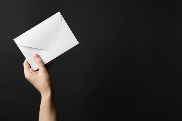 Woman Holding White Paper Envelope Black Background Closeup Space Text — Stock Photo, Image