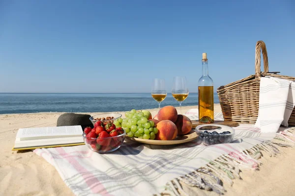 Food and wine on beach. Summer picnic