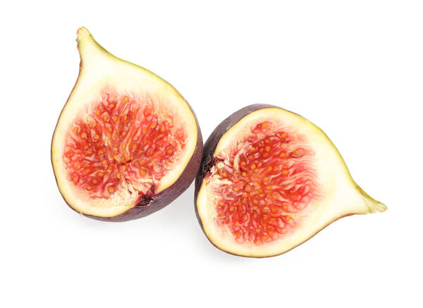 Halves of tasty fresh fig on white background, top view
