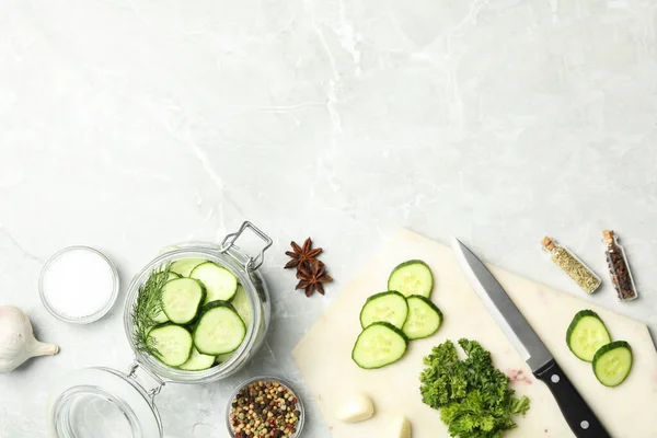 Pickling jar with fresh ripe cucumbers and spices on grey table, flat lay. Space for text — Stock Image Pickling Jar Fresh Ripe Cucumbers Spices Grey Table Flat Lay Stock Image
