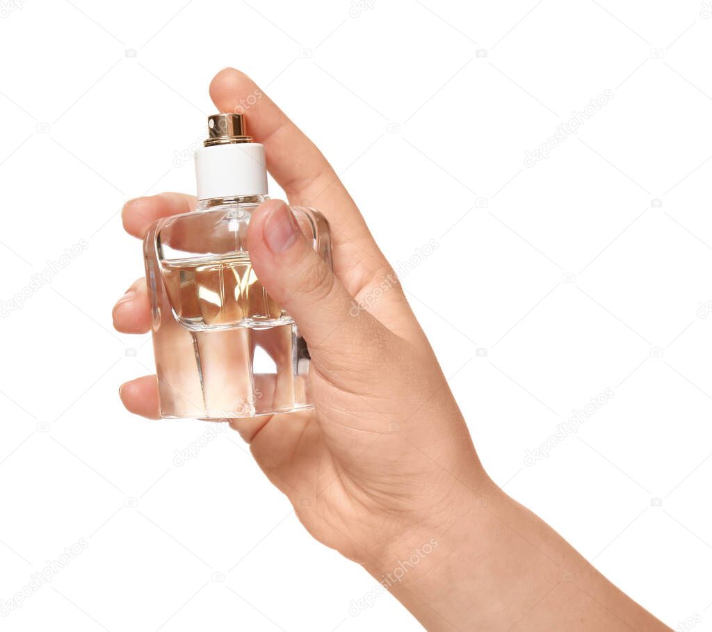 Woman with bottle of perfume on white background, closeup