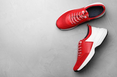Pair of stylish shoes on grey background, top view. Space for text clipart