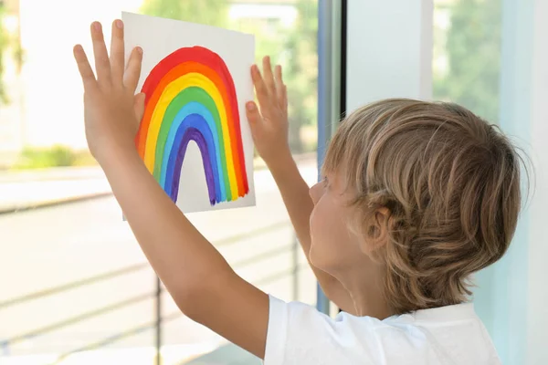 Little Boy Holding Rainbow Painting Window Indoors Stay Home Concept — Stock Photo, Image