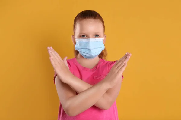 Little Girl Protective Mask Showing Stop Gesture Yellow Background Prevent — Stock Photo, Image