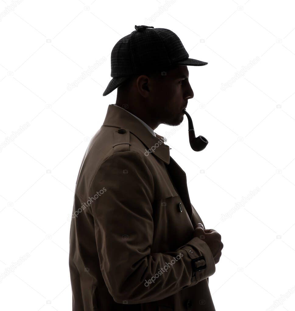 Old fashioned detective with smoking pipe on white background