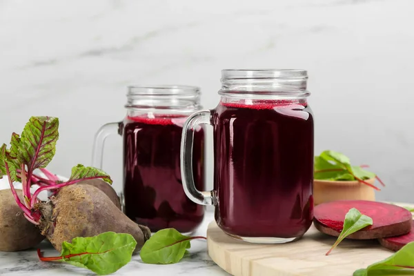 Freshly made beet juice on white table — Stock Image Freshly Made Beet Juice White Table Stock Image
