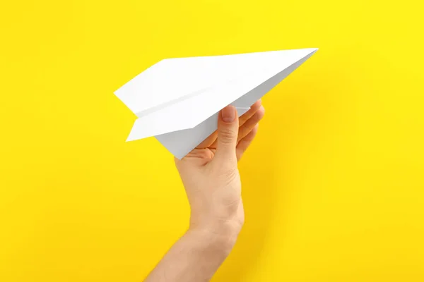 Woman Holding Paper Plane Yellow Background Closeup — Stock Photo, Image