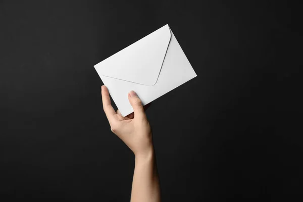 Woman Holding White Paper Envelope Black Background Closeup — Stock Photo, Image