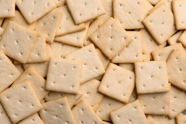 Many Delicious Crackers Background Top View — Stock Photo, Image