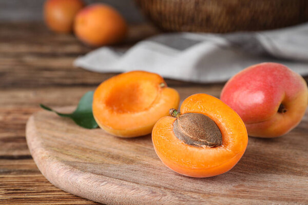 Delicious fresh ripe apricots on wooden table, closeup
