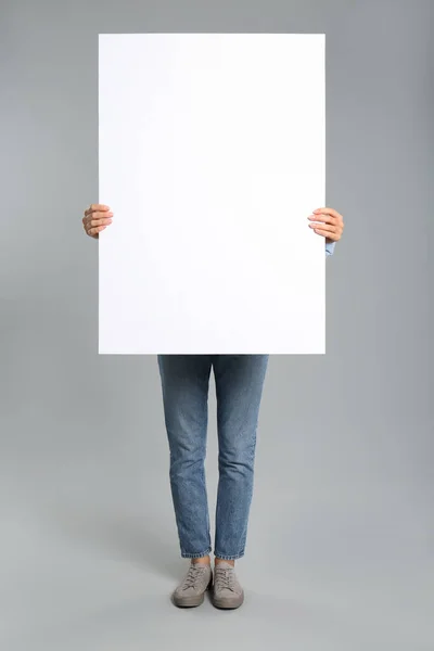 Woman Holding White Blank Poster Grey Background Mockup Design — Stock Photo, Image