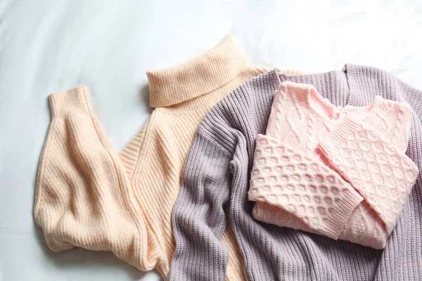 Stylish Knitted Sweaters White Fabric Flat Lay — Stock Photo, Image