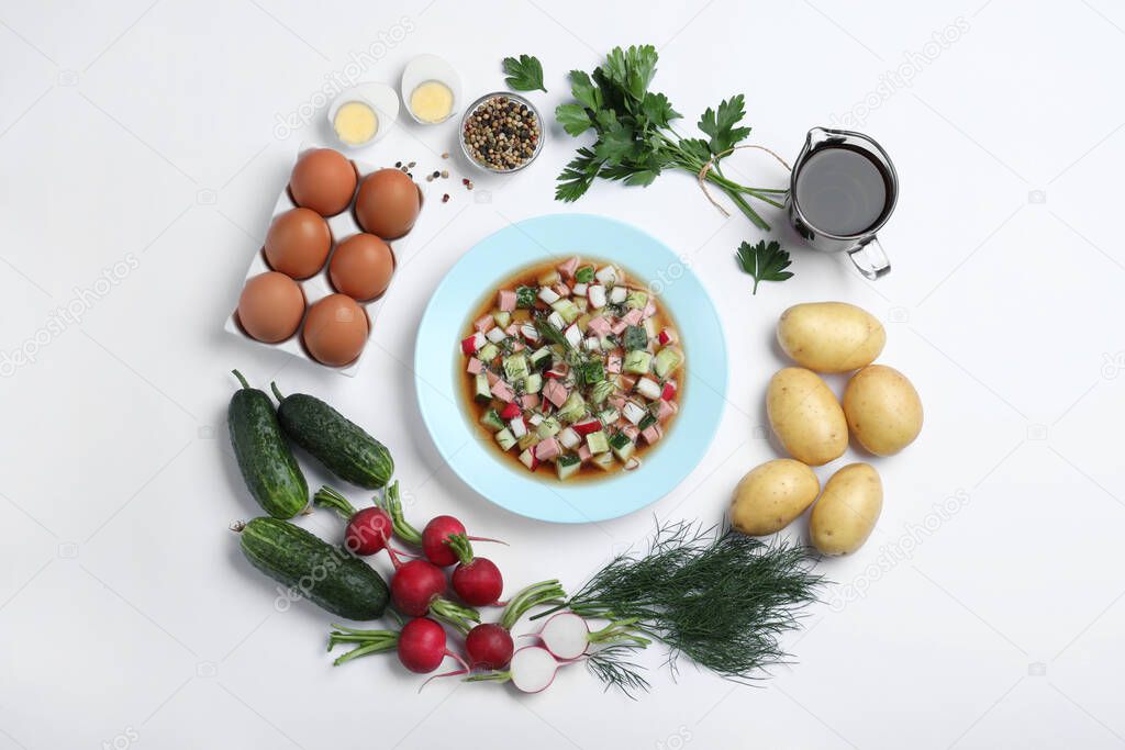 Cold okroshka with kvass and ingredients on white background, top view. Traditional Russian summer soup