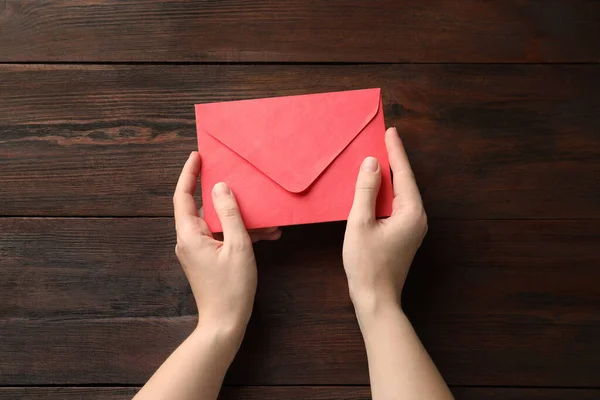 Woman Red Paper Envelope Wooden Table Top View — Stock Photo, Image