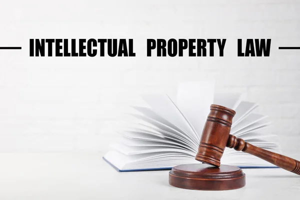 Text Intellectual Property Law over judge\'s gavel and book on table