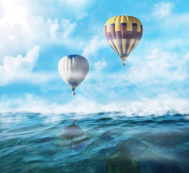 Hayal dünyası. Sıcak hava balonları sisli denizin üzerinde bulutlarla