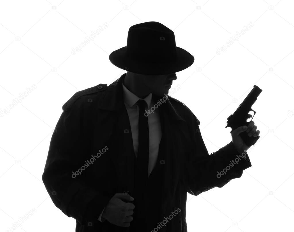 Old fashioned detective with gun on white background