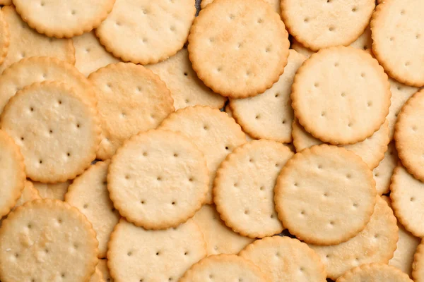 Veel Heerlijke Crackers Als Achtergrond Bovenaanzicht — Stockfoto