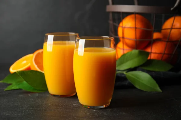 Glasses Orange Juice Fresh Fruits Black Table — Stock Photo, Image