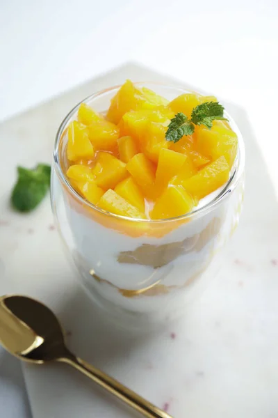 Tasty Peach Dessert Yogurt Served White Table Royalty Free Stock Images