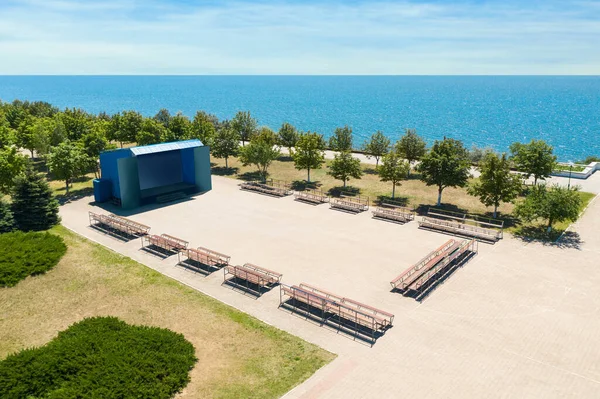 Outdoor cinema and entertainment place near sea on sunny day