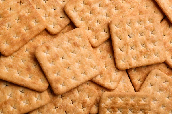 Veel Heerlijke Crackers Als Achtergrond Bovenaanzicht — Stockfoto