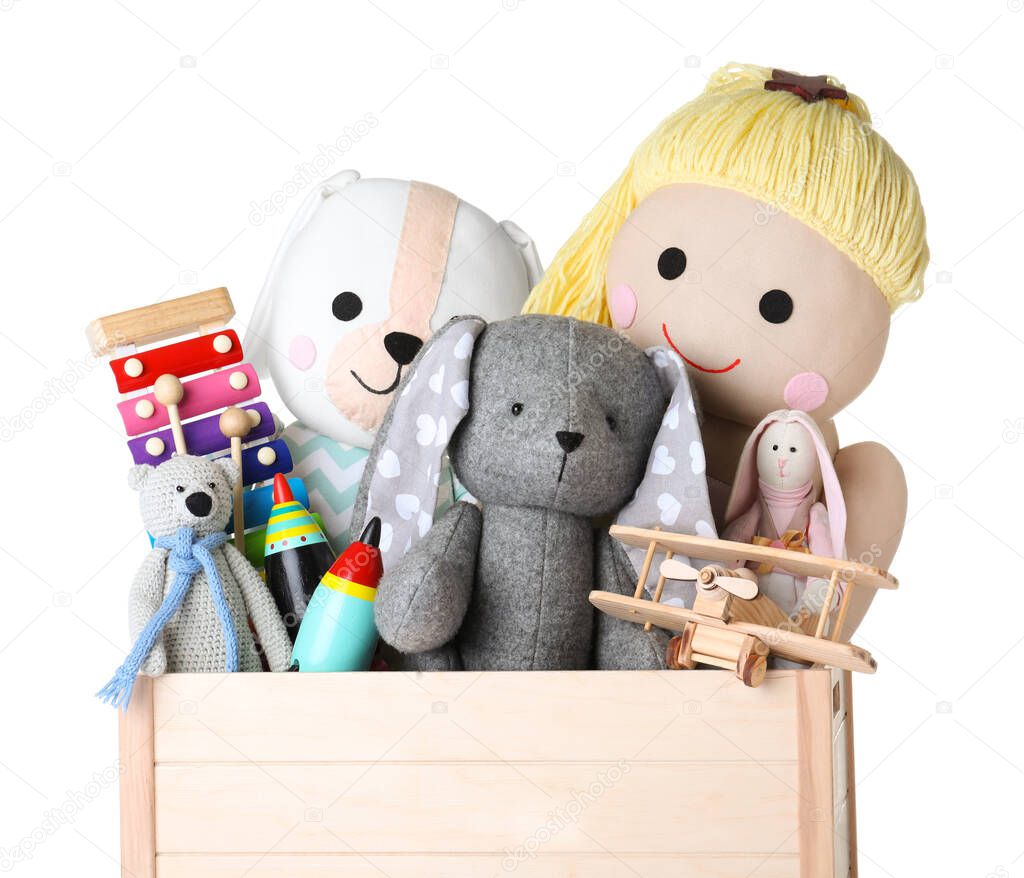 Wooden crate with different toys isolated on white, closeup
