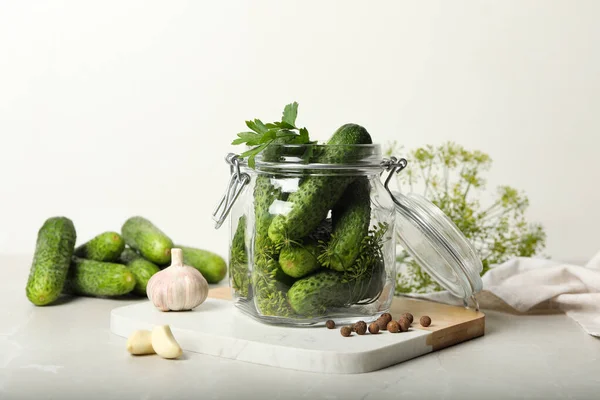 Pickling jar with fresh cucumbers on light table — Stock Image Pickling Jar Fresh Cucumbers Light Table Royalty Free Stock Photos