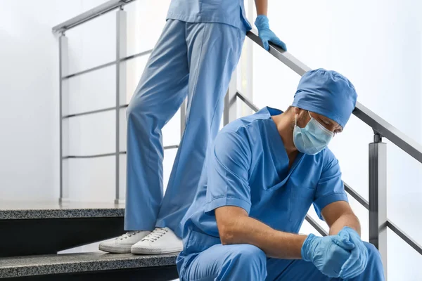 Exhausted Doctors Stairs Indoors Stress Health Care Workers Covid Pandemic — Stock Photo, Image